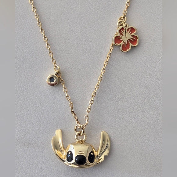 Disney Jewelry - Stitch Gold-Tone Necklace with Hibiscus Flower & Crystal Accents